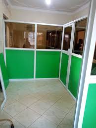 A green aluminum and glass partition