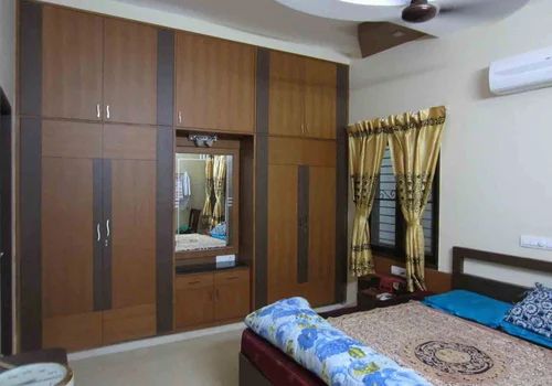 A wooden wardrobe in a room
