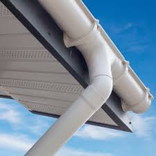A gutter on the edge of a roof with an extension downwards