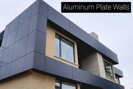 A gray aluminum wall plate on a building surface.