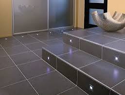 Black tiles, well installed on the floor & stairs