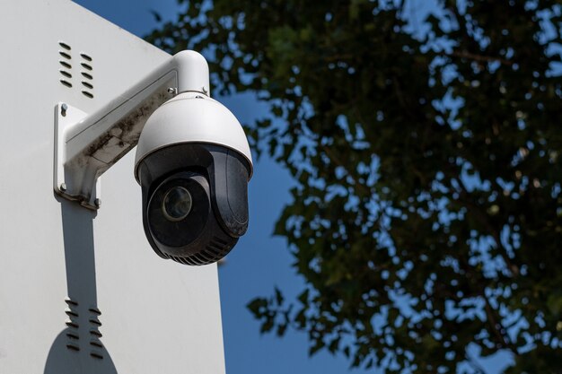  A PTZ CCTV camera hanging on the wall