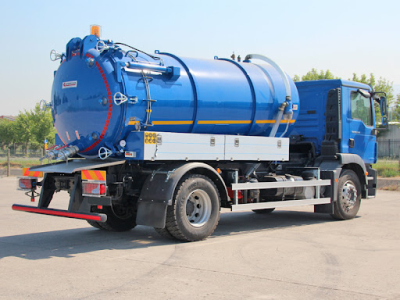  The back and side view of a blue sewage truck