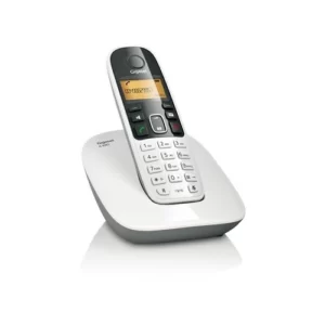 A single silver office telephone in a white background