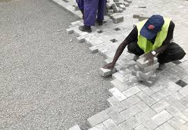 Technicians installing pavers